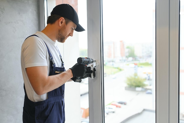 construction-worker-repairing-window-house_255667-47972